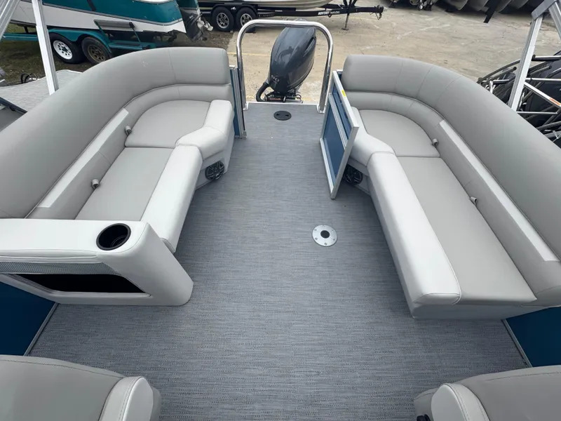 Slide: The Image of 2025 Godfrey EX2286SBX pontoon boat interior with gray seating and carpet. - 9
