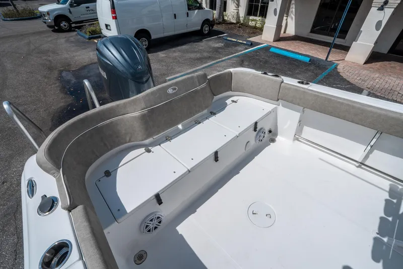 Slide: The Image of 2025 Sea Hunt Ultra 234 boat interior with seating and storage compartments. - 13