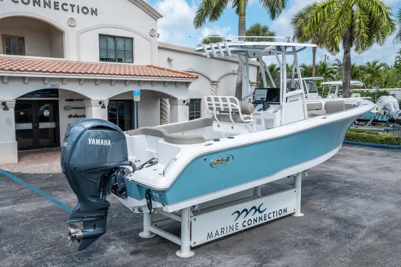 Slide: The Image of 2025 Sea Hunt Ultra 234 boat with Yamaha engine at Marine Connection dealership. - 2