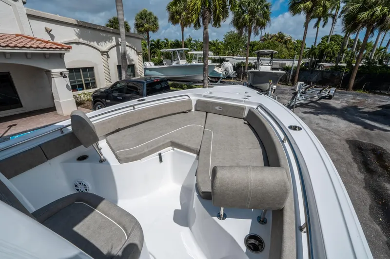 Slide: The Image of 2025 Sea Hunt Ultra 234 boat with spacious seating and modern design. - 22