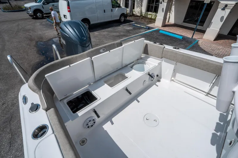 Slide: The Image of 2025 Sea Hunt Ultra 234 boat interior with storage compartments and seating. - 14