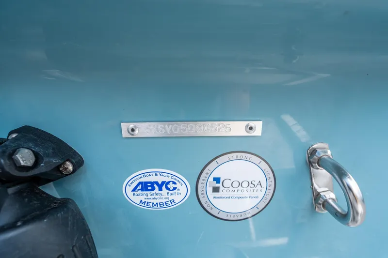 Slide: The Image of 2025 Sea Hunt Ultra 234 boat with ABYC and Coosa Composites labels. - 30