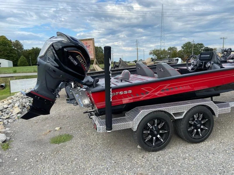 Slide: The Image of 2024 Xpress X19 Pro boat on trailer with Yamaha outboard motor. - 3