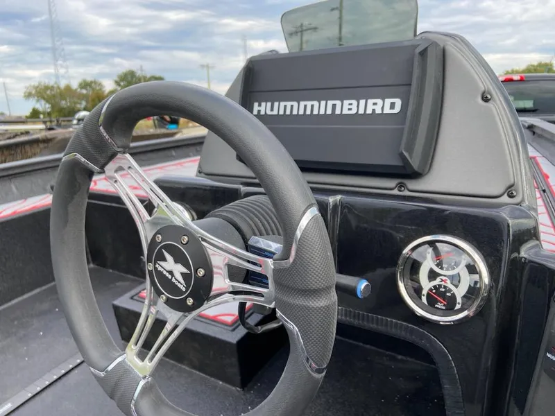 Slide: The Image of Steering wheel and dashboard of 2024 Xpress X19 Pro boat with Humminbird display. - 4