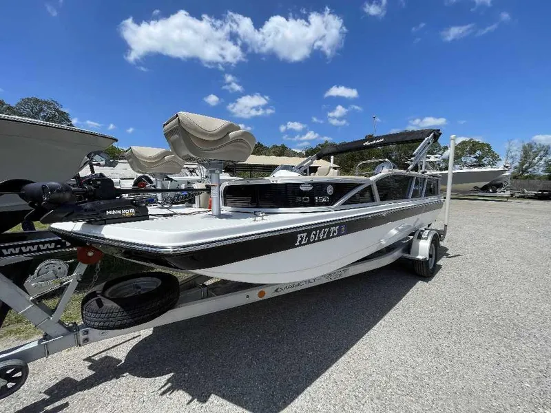 Slide: The Image of 2023 Hurricane Fundeck 198 Fish Package boat on trailer under blue sky. - 0
