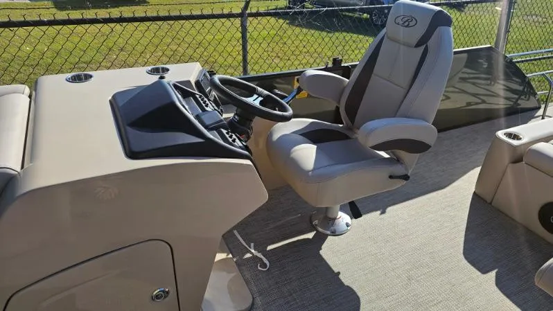 Slide: The Image of 2025 Bentley Pontoons Legacy 243 Swingback helm with captain's chair and steering wheel. - 3