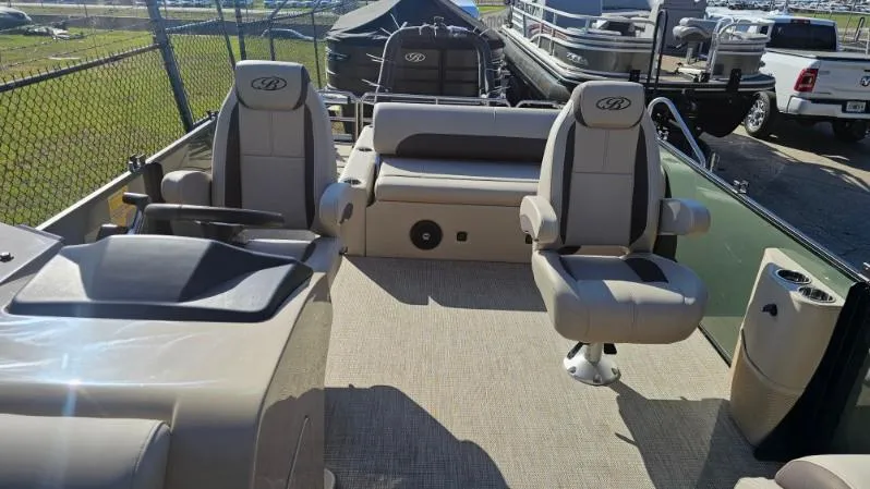 Slide: The Image of 2025 Bentley Pontoons Legacy 243 Swingback interior with seating and helm, showcasing luxury design. - 6