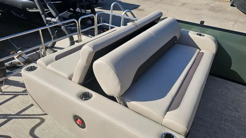 Slide: The Image of 2025 Bentley Pontoons Legacy 243 Swingback with beige seating and cup holders. - 7