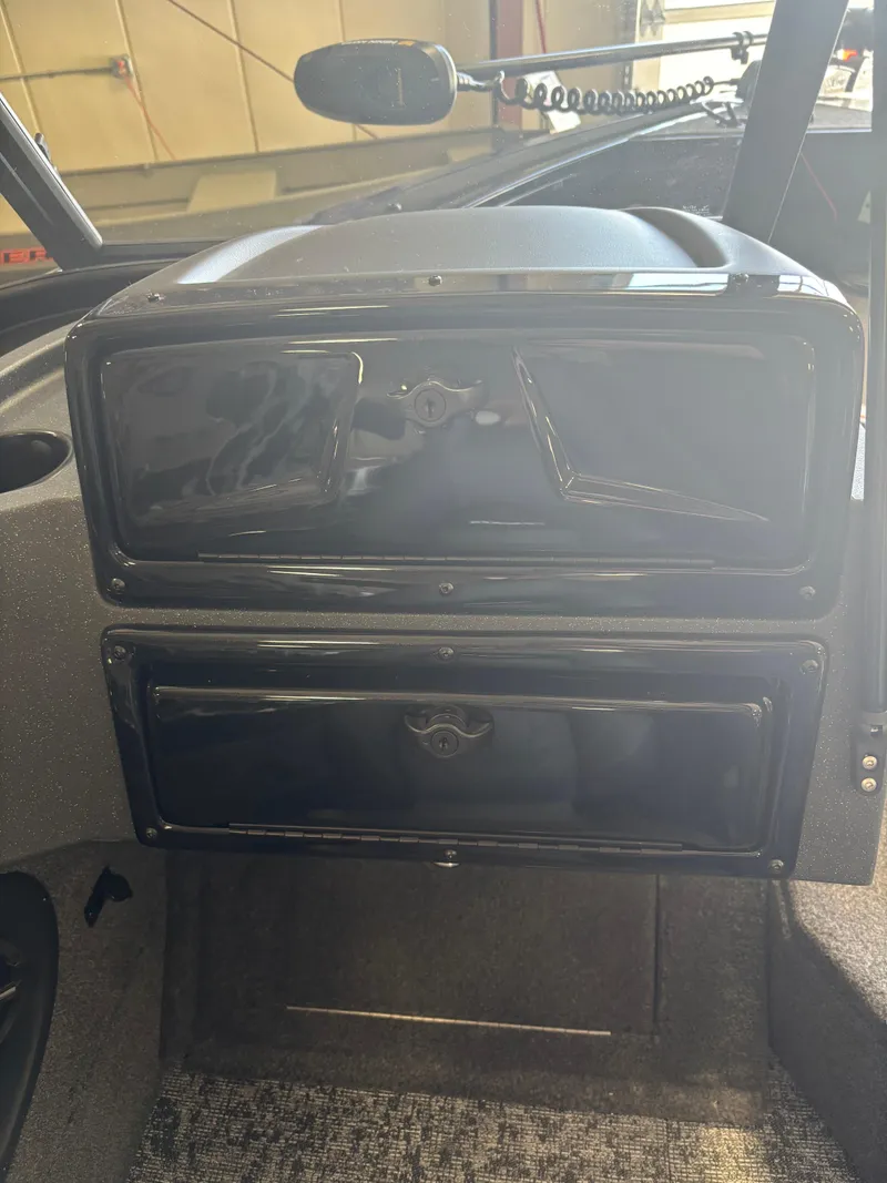 Slide: The Image of 2025 Tracker Targa V-18 Combo dashboard with storage compartments. - 14