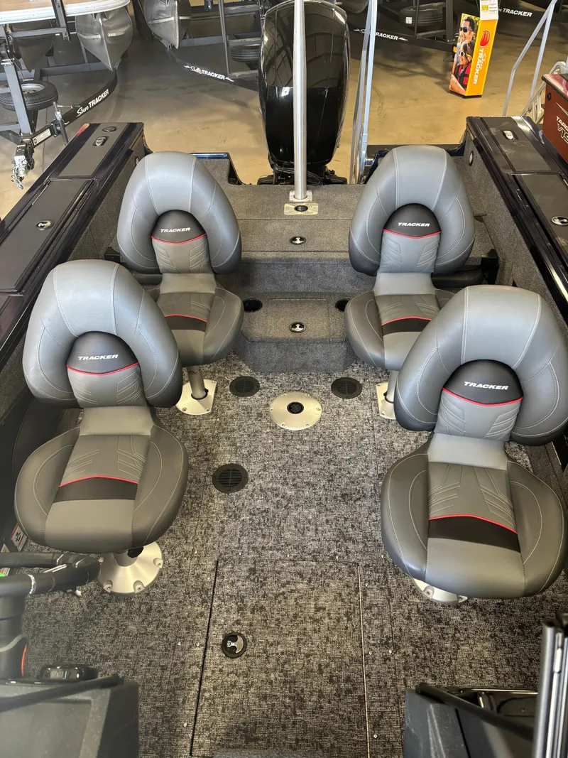 Slide: The Image of 2025 Tracker Targa V-18 Combo boat interior with four gray seats. - 17