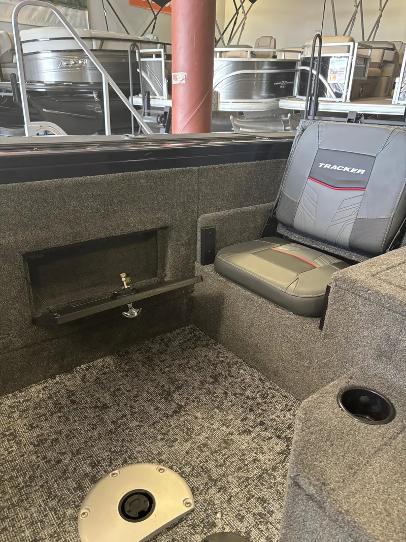 Slide: The Image of 2025 Tracker Targa V-18 Combo boat interior with seating and storage. - 5