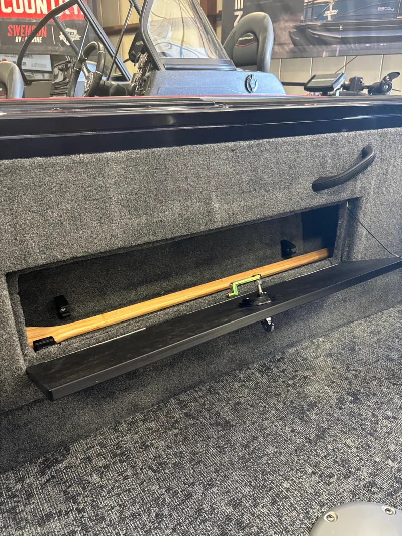 Slide: The Image of 2025 Tracker Targa V-18 Combo boat interior with rod storage compartment. - 6