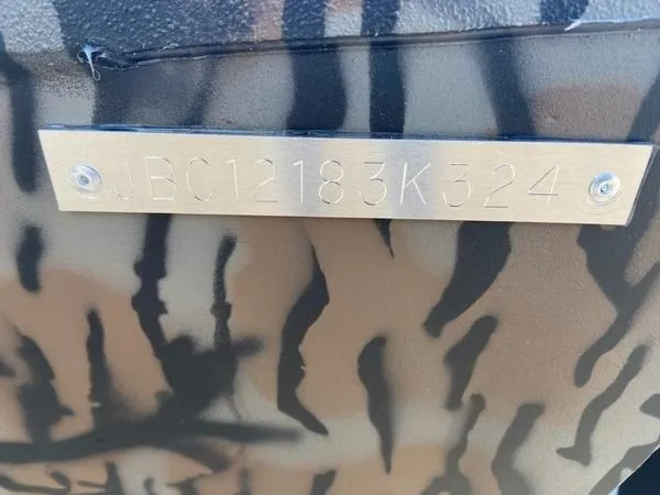 Slide: The Image of Metallic identification plate on Xpress XP200, 2024 model, with camouflage pattern. - 14
