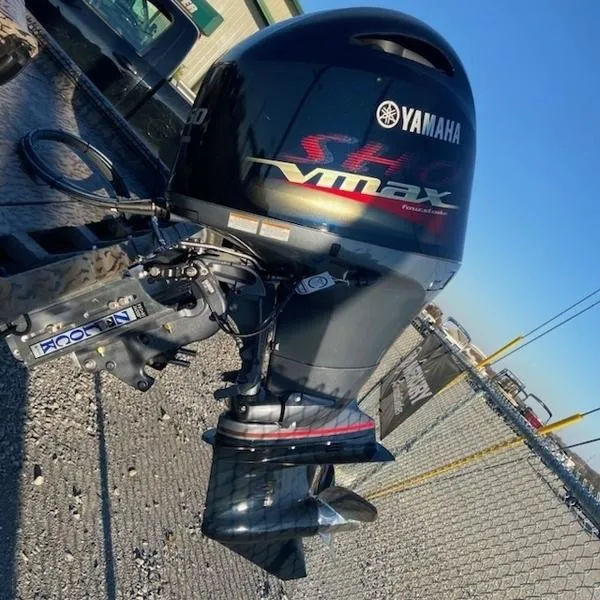 Slide: The Image of 2024 Xpress XP200 boat with Yamaha VMAX outboard motor, parked on gravel. - 4