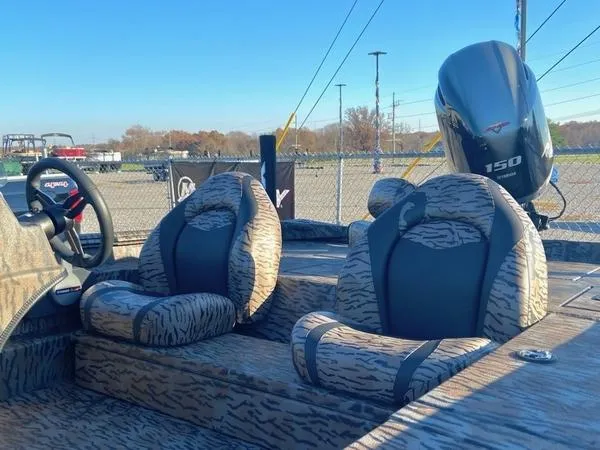 Slide: The Image of 2024 Xpress XP200 boat interior with patterned seats and a 150 HP outboard motor. - 8