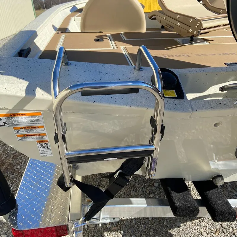 Slide: The Image of 2024 Xpress H18C boat with a mounted metal ladder on the rear deck. - 6