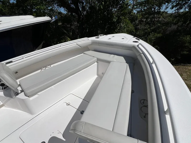 Slide: The Image of 2022 Everglades 273 CC boat with spacious seating and sleek design. - 18