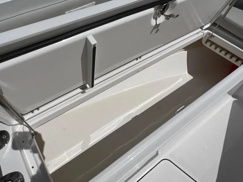 Slide: The Image of Open storage compartment on 2022 Everglades 273 CC boat, showcasing spacious interior. - 20