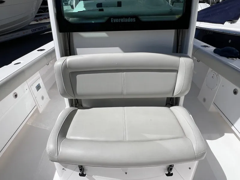 Slide: The Image of 2022 Everglades 273 CC boat with cushioned seating and sleek design. - 21
