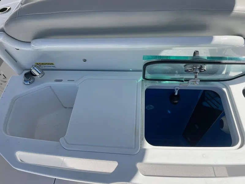 Slide: The Image of 2022 Everglades 273 CC boat sink and cutting board setup. - 25