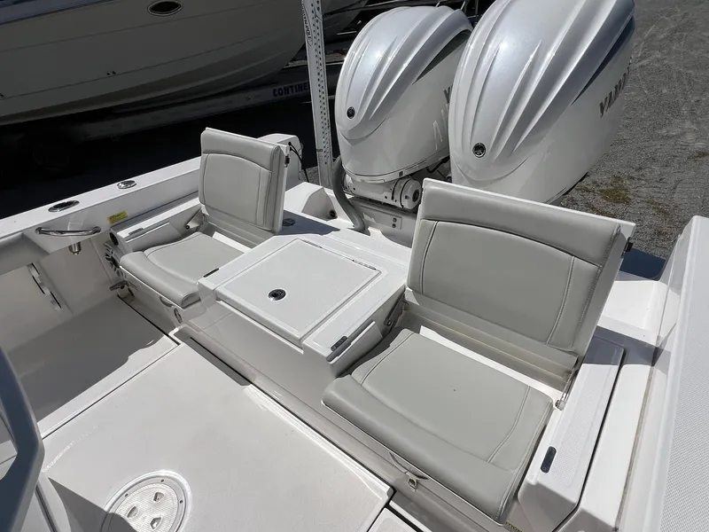 Slide: The Image of 2022 Everglades 273 CC boat with dual outboard engines and comfortable seating. - 26