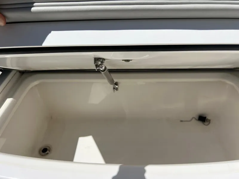 Slide: The Image of Open storage compartment in 2022 Everglades 273 CC boat. - 27