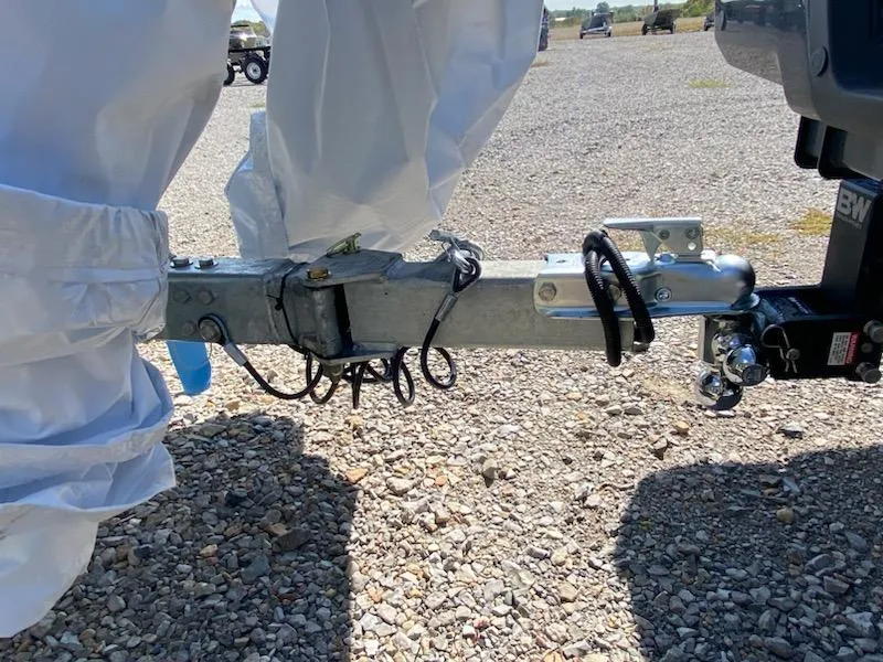 Slide: The Image of Trailer hitch of 2024 Xpress XP185 Catfish on gravel surface. - 10