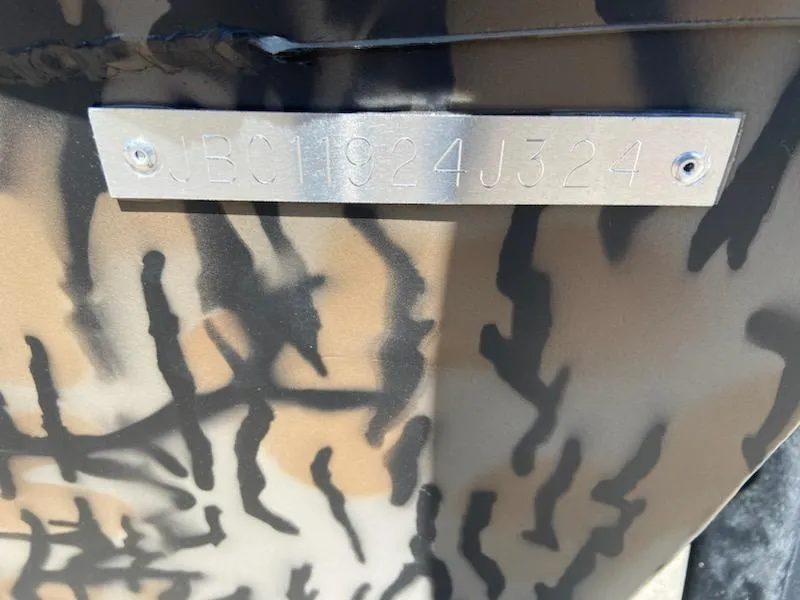 Slide: The Image of 2024 Xpress XP185 Catfish boat with camouflage pattern and visible serial number plate. - 18