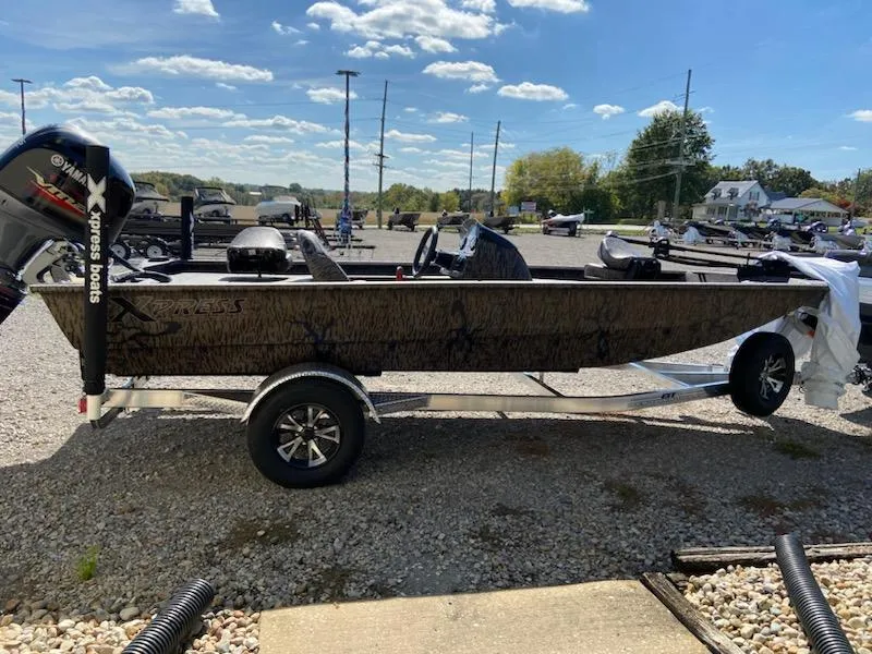 Slide: The Image of 2024 Xpress XP185 Catfish boat on trailer in outdoor setting. - 4