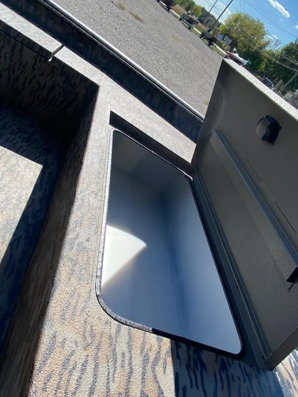 Slide: The Image of 2024 Xpress XP185 Catfish boat with open storage compartment, showcasing interior design. - 8