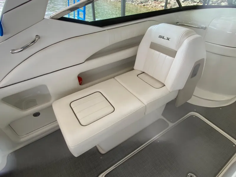 Slide: The Image of 2010 Sea Ray 300 SLX boat interior with white leather seating. - 20