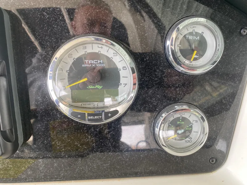 Slide: The Image of Dashboard gauges of a 2010 Sea Ray 300 SLX boat. - 30