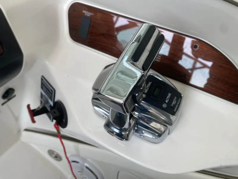 Slide: The Image of Control panel of 2010 Sea Ray 300 SLX boat with chrome throttle lever. - 31