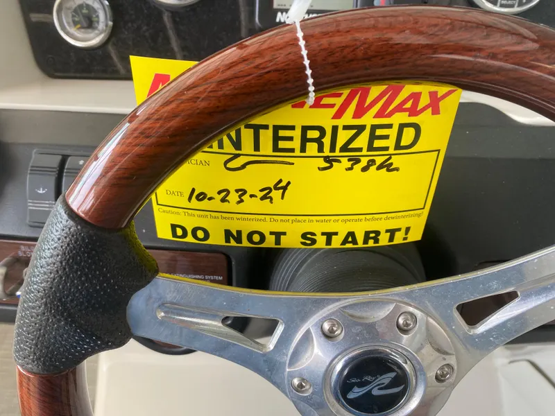 Slide: The Image of Steering wheel of a 2010 Sea Ray 300 SLX with a "Do Not Start" tag. - 32