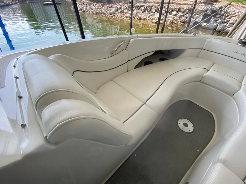 Slide: The Image of Luxurious seating area on a 2010 Sea Ray 300 SLX boat, featuring white upholstery. - 35
