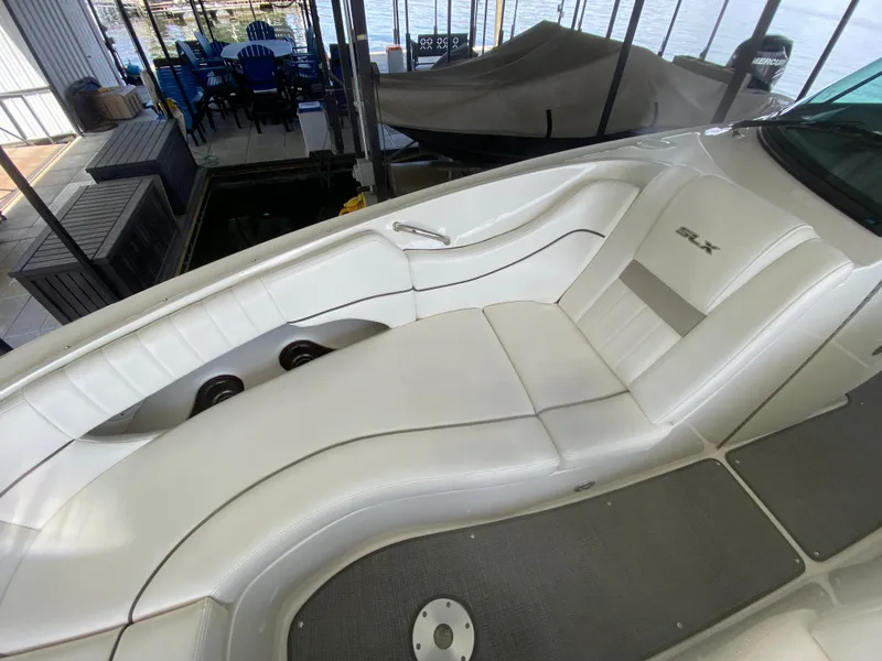Slide: The Image of 2010 Sea Ray 300 SLX boat interior with white seating and sleek design. - 39
