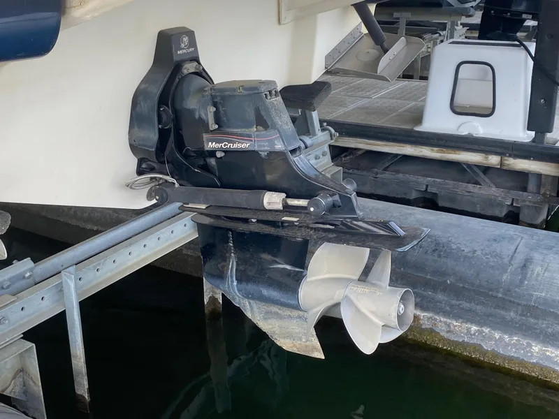 Slide: The Image of MerCruiser outdrive on a 2010 Sea Ray 300 SLX boat at dock. - 4
