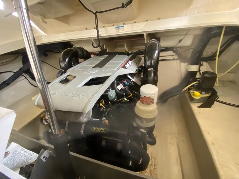 Slide: The Image of Engine compartment of a 2010 Sea Ray 300 SLX boat, showcasing the engine details. - 46