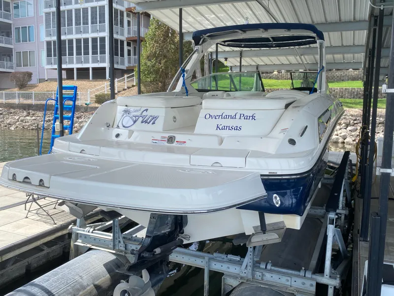 Slide: The Image of 2010 Sea Ray 300 SLX boat docked under a covered marina in Overland Park, Kansas. - 5
