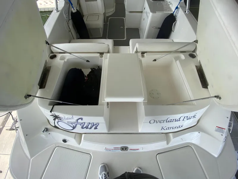 Slide: The Image of 2010 Sea Ray 300 SLX boat interior with seating and storage, labeled "Overland Park, Kansas." - 8