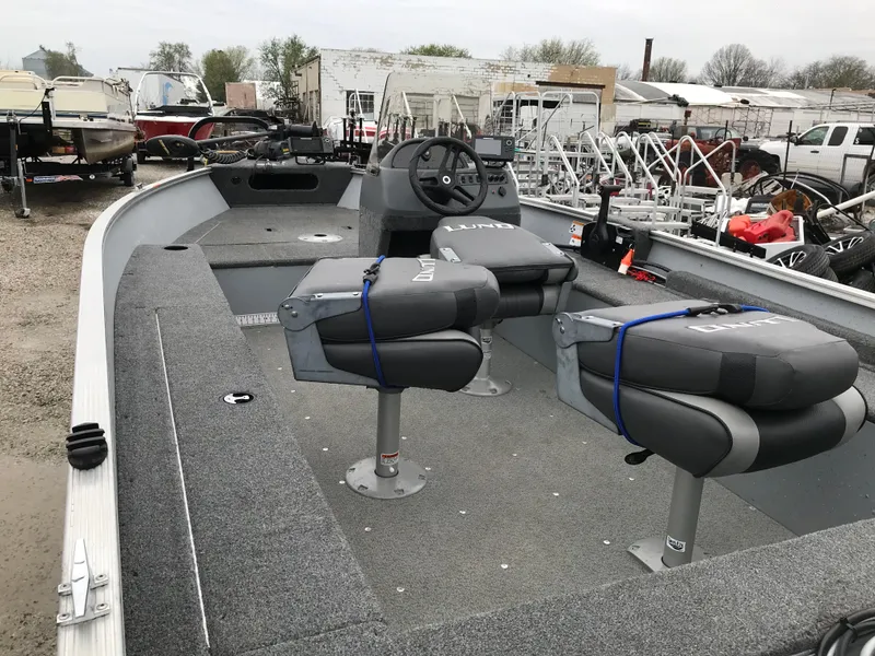 Slide: The Image of 2016 Lund 1600 Rebel SS fishing boat with dual seats and steering console. - 12