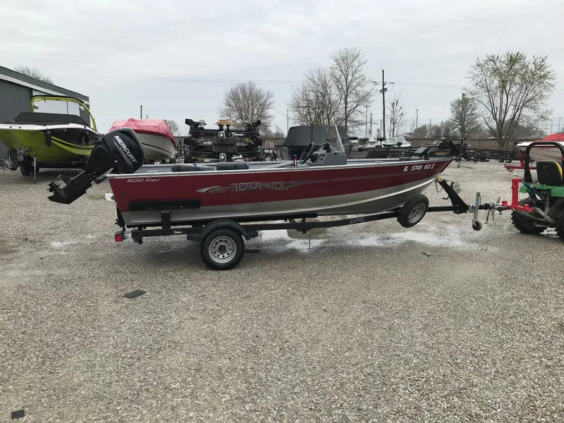 Slide: The Image of 2016 Lund 1600 Rebel SS boat on trailer in outdoor setting. - 5