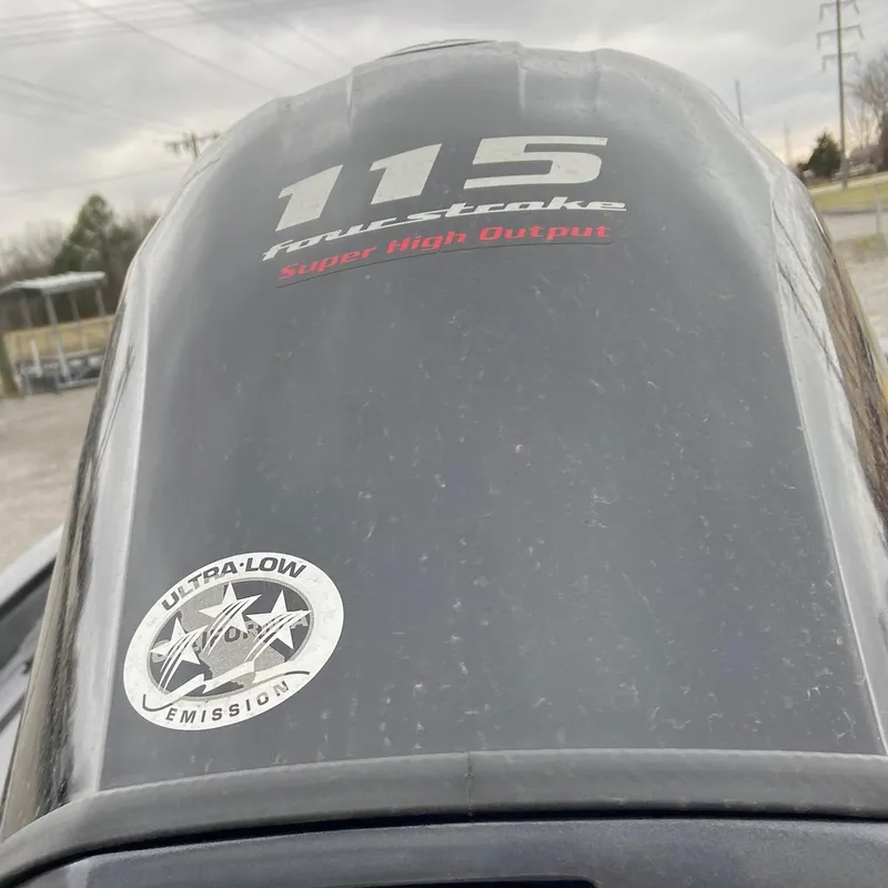 Slide: The Image of Outboard motor with "115 Four Stroke" and "Ultra-Low Emission" labels, Xpress H18C 2024 model. - 3