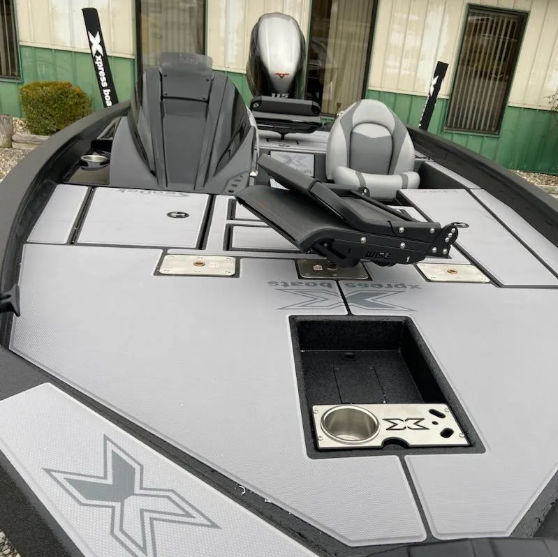 Slide: The Image of 2024 Xpress H18C boat interior with seating and storage compartments. - 7