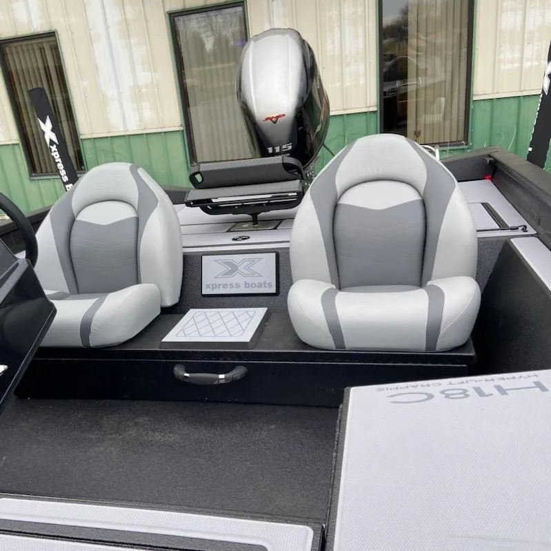 Slide: The Image of 2024 Xpress H18C boat interior with dual gray seats and 115 horsepower engine. - 8