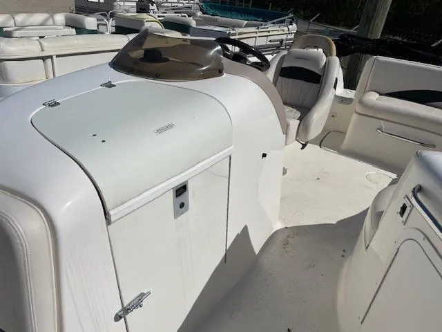 Slide: The Image of 2000 Chaparral Sunesta 232 boat interior with seating and helm. - 10