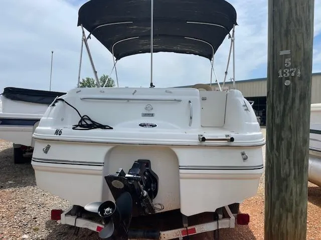 Slide: The Image of 2000 Chaparral Sunesta 232 boat with canopy, rear view on trailer. - 2