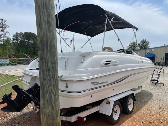 Slide: The Image of 2000 Chaparral Sunesta 232 boat on trailer with canopy, parked outdoors. - 3