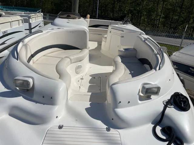 Slide: The Image of 2000 Chaparral Sunesta 232 boat with spacious seating and white interior. - 5