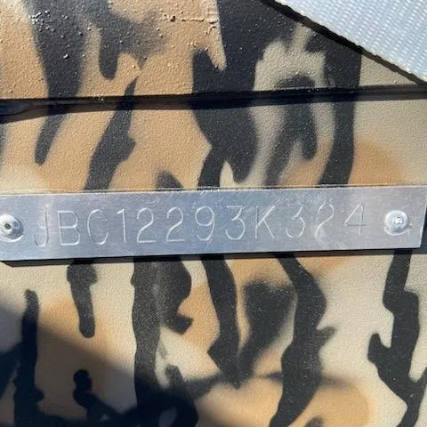 Slide: The Image of 2024 Xpress XP180 camouflage pattern with metal identification plate, code JBC12293K324. - 11